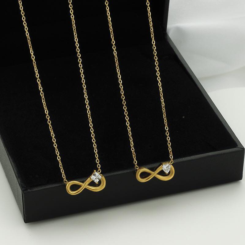 Pendentif signe de l'infini avec diamant doré