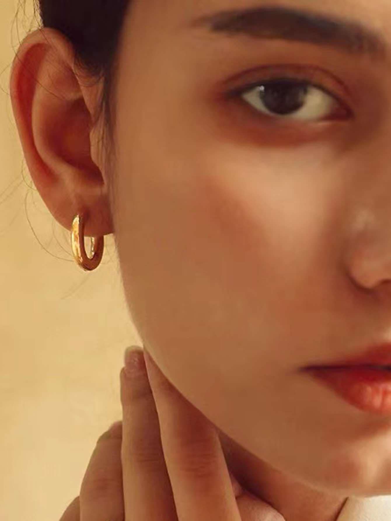 Boucle d'oreilles moitié doré moitié argenté