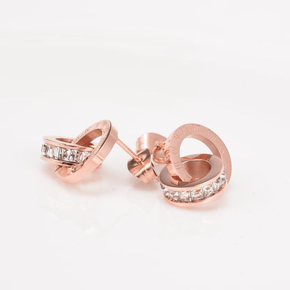 Boucle d'oreilles rose doré avec chiffres romain et diamant